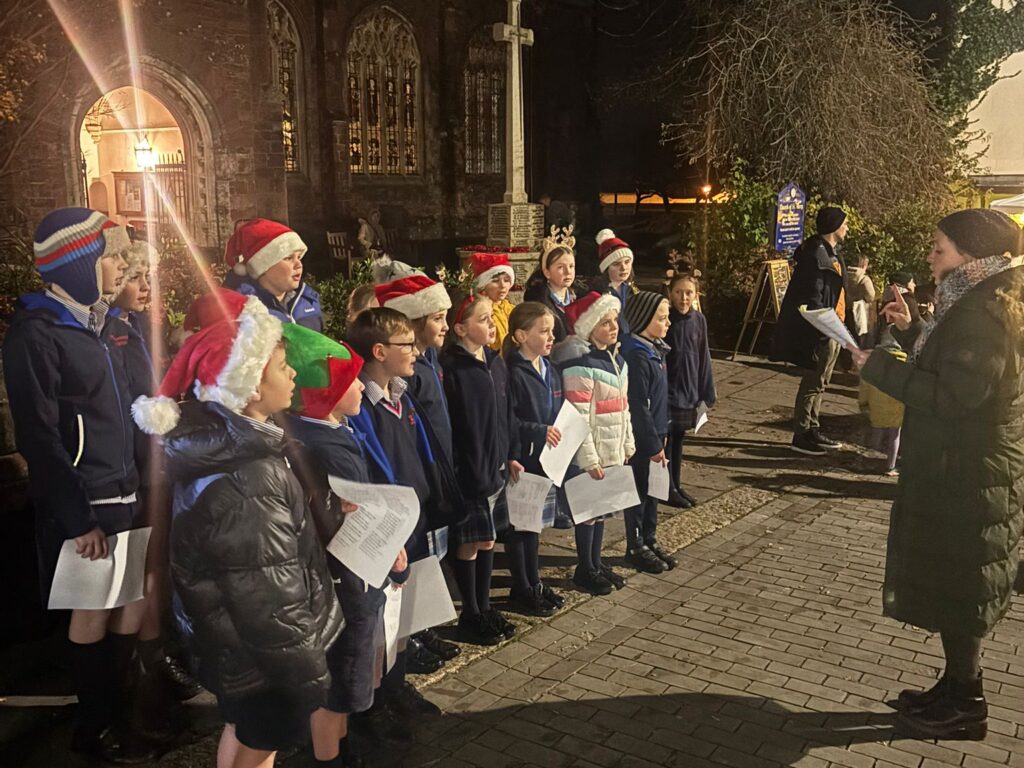 St Christopher's Prep School and Nursery's school choir sang carols outside St Mary's Church, Totnes
